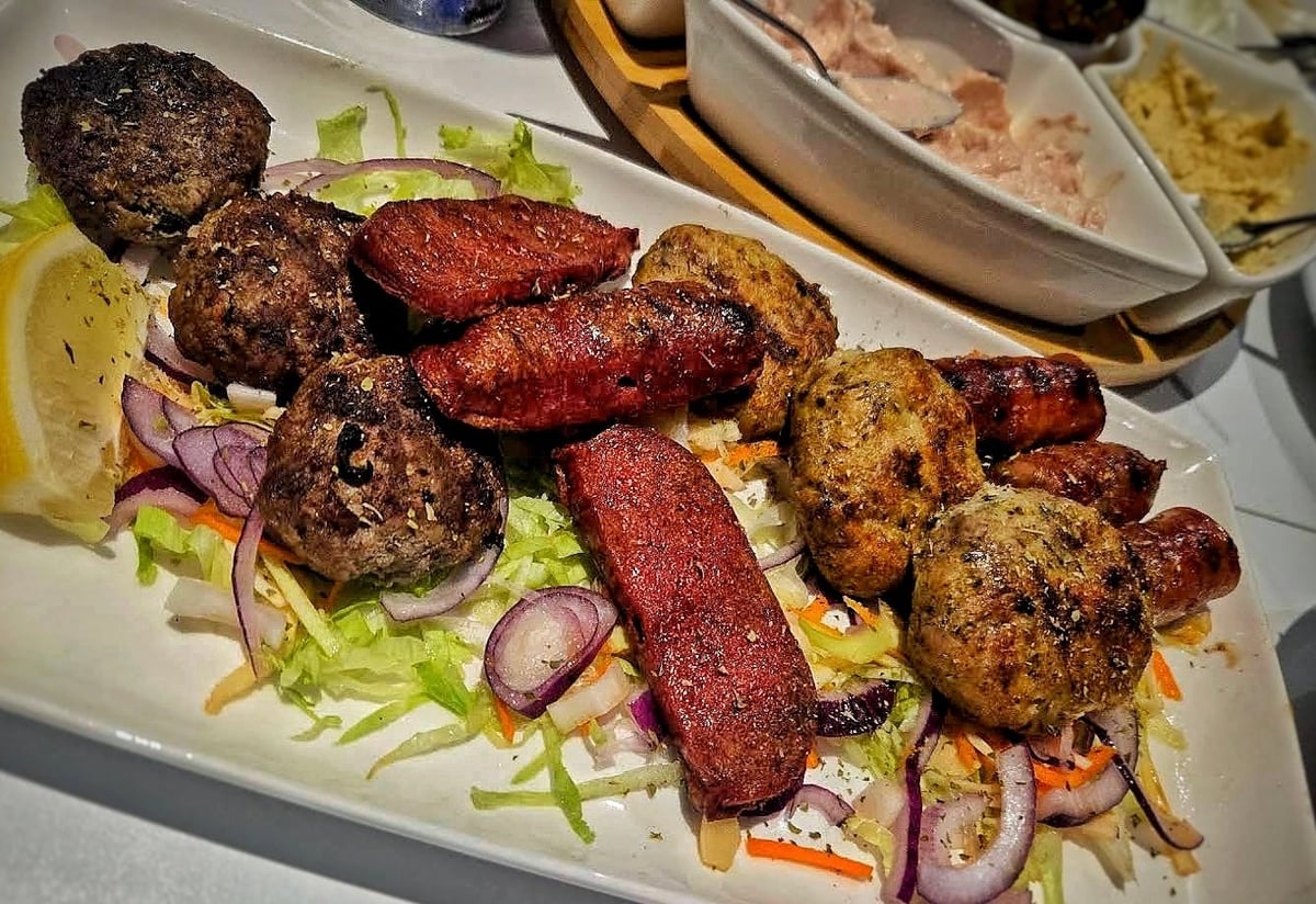 Grilled keftedes and loukaniko served at Zorba